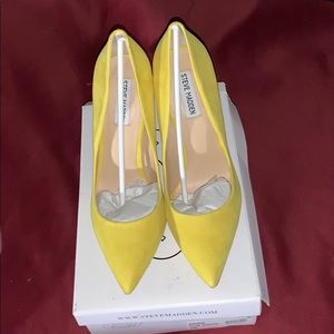 Yellow suede pumps